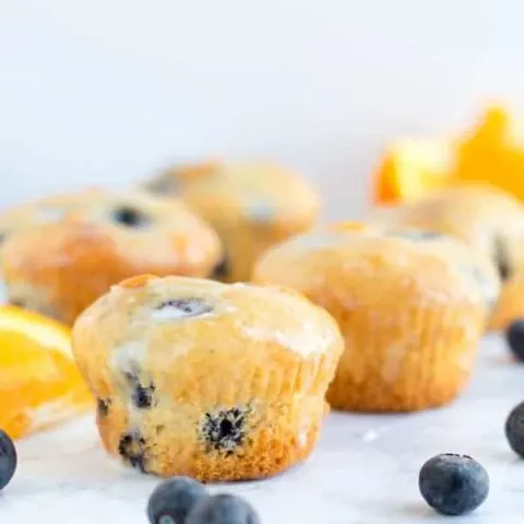 Sweet and tart blueberry orange muffins are one of my favorite flavors for spring! Plus they're one of my all time favorite stand-in-front-of-the-fridge-shoving-your-face late night snacks!
