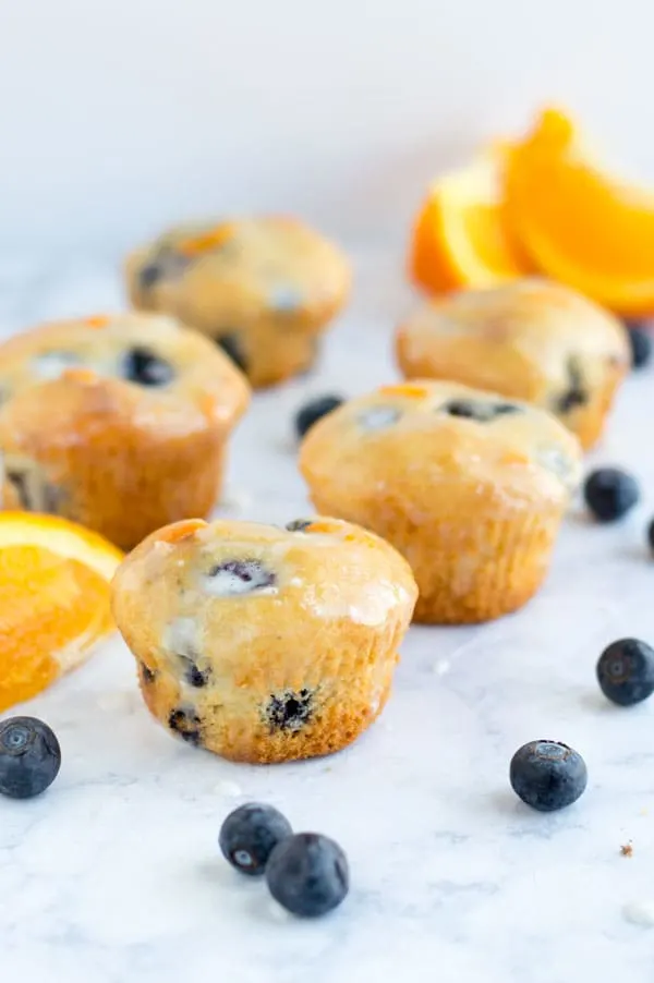Sweet and tart blueberry orange muffins are one of my favorite flavors for spring! Plus they're one of my all time favorite stand-in-front-of-the-fridge-shoving-your-face late night snacks!