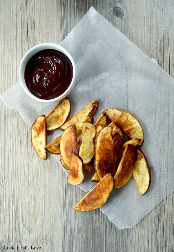 Potato wedges baked in the oven are a healthy alternative to a fried potato wedge. Enjoy these super simple baked potato wedges with your next burger! You won't even believe the secret to a perfect crispy potato wedge! 