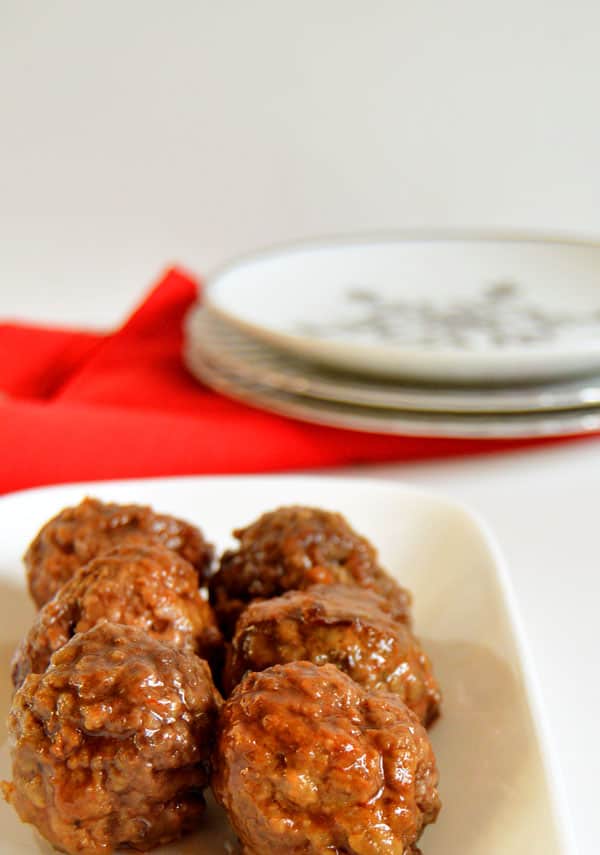 Sriracha and honey come together perfectly as the sweet and spicy sauce covering homemade meatballs! Simmer them all day in the crock pot for an easy but flavorful appetizer!