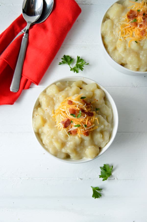 Crock pot baked potato soup is creamy and delicious without using any heavy cream. Try this slow cooker loaded baked potato soup to warm you up this winter!