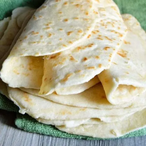 These easy homemade tortillas are a great addition to your next Mexican feast! And because they're made with coconut oil they're healthier for you, too!