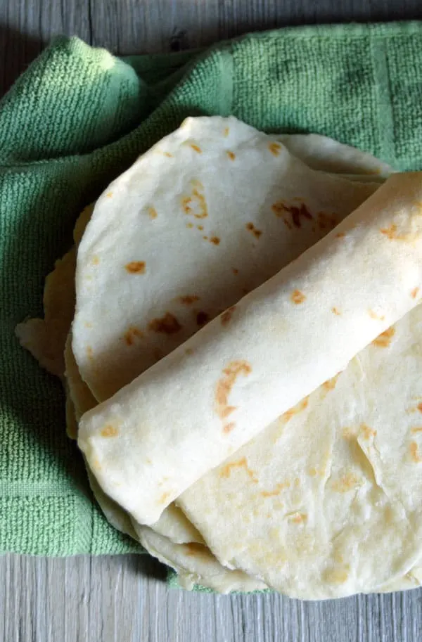 These easy homemade tortillas are a great addition to your next Mexican feast! And because they're made with coconut oil they're healthier for you, too!