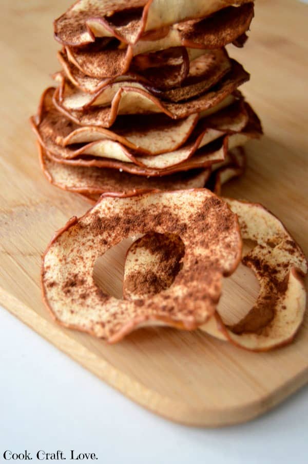 Need a new apple recipe because you're tired of apple crisps and apple pie? Try these this amazing oven baked apple chip recipe for a healthy snack your whole family will love! Plus learn how I finally mastered the art of perfect apple chips!