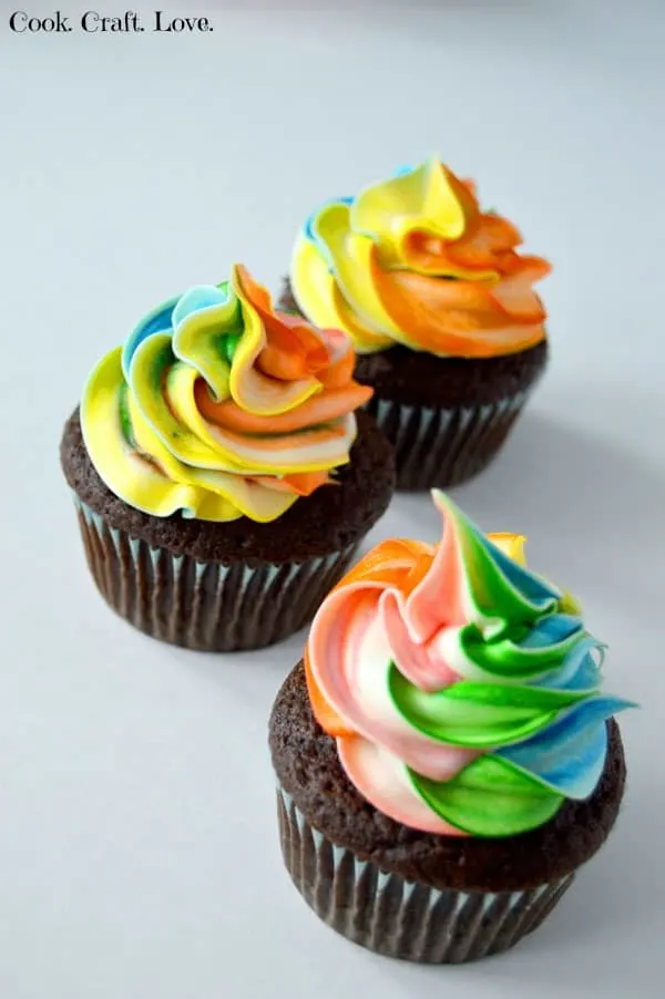 For a seriously delicious cupcake fix try this easy and fun cupcake recipe with rainbow frosting. And you'll never believe how super simple the frosting is either!