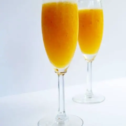 Cool down this summer with a delicious peach bellini and change it up by using your favorite frozen fruit to make your own perfect bellini