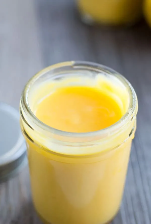 Enjoy summer with this tart and simple lemon curd. It comes together in just 15 minutes and is a lemon curd recipe good enough to slather on anything. Even a spoon!