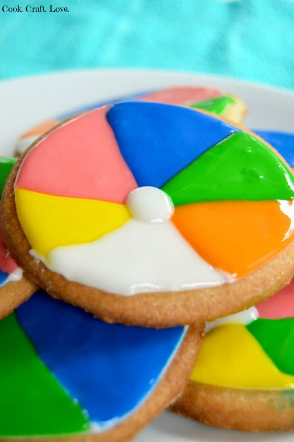 Beach ball cookies are a fun and unique way to celebrate summer! Enjoy these festive beach ball cookies at the end of the school year picnic or by the pool