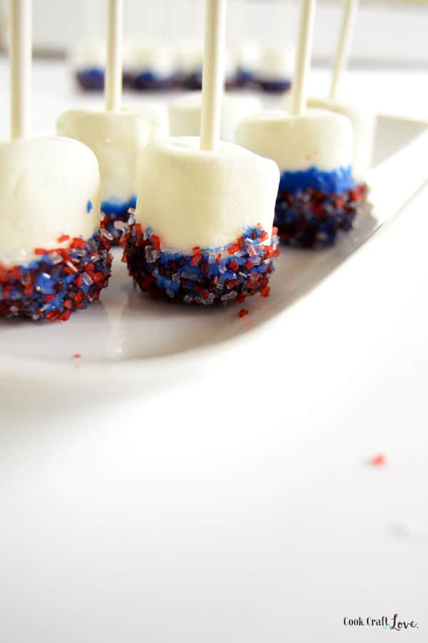 Simple DIY Marshmallow Pops are so easy the kids can make them but elegant enough to serve them at your next party, baby shower, or holiday gathering as a fun marshmallow pop centerpiece and easy treat.