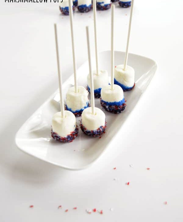 Simple DIY Marshmallow Pops are so easy the kids can make them but elegant enough to serve them at your next party, baby shower, or holiday gathering as a fun marshmallow pop centerpiece and easy treat.