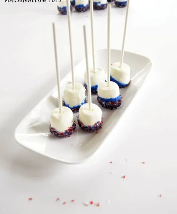 Simple DIY Marshmallow Pops are so easy the kids can make them but elegant enough to serve them at your next party, baby shower, or holiday gathering as a fun marshmallow pop centerpiece and easy treat.