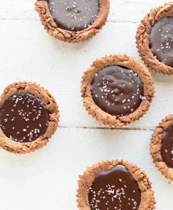 Dark chocolate is transformed into a creamy decadent ganache with a chocolate shortbread crust in these sinful dark chocolate ganache tartlets. You won't be able to eat just one!