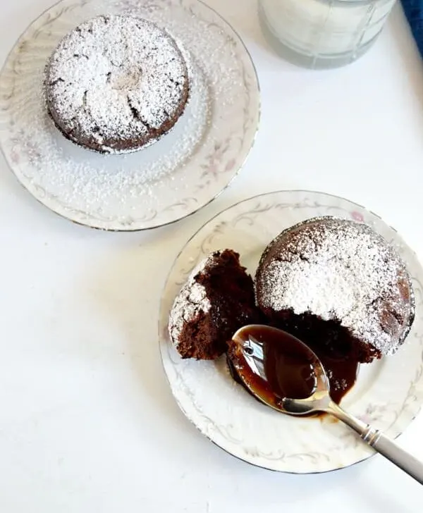 Molten chocolate cake is a decadent dessert that will wow your guests at your next dinner party even though it's an effortless dessert!