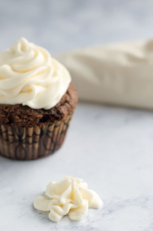 White chocolate ganache frosting is creamy and fluffy and perfect on cupcakes, cookies, or spoons!