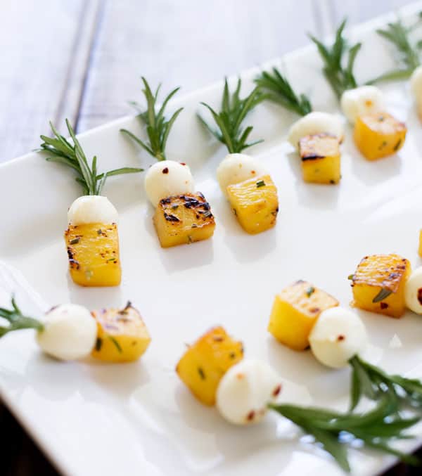 Sweet pineapple and creamy mozzarella cheese sauteed in rosemary infused olive oil make a perfect two bite appetizer! You'll love this combo!
