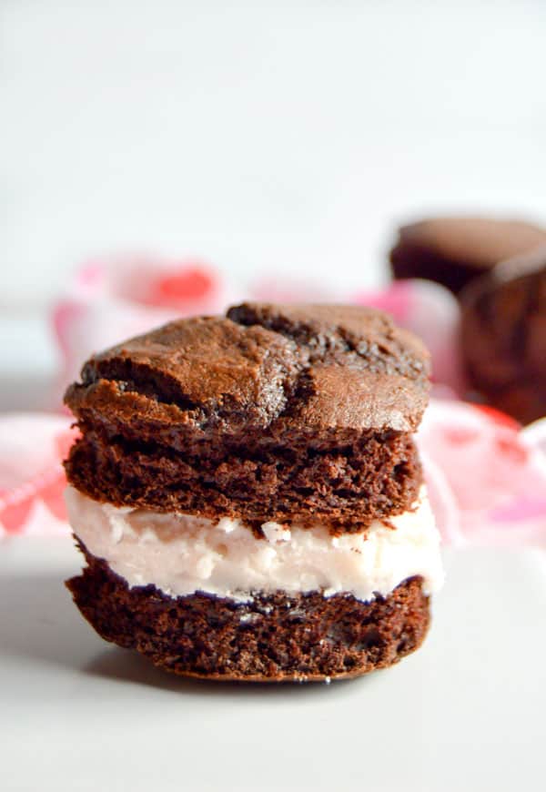 Whoopie pies are an American classic. These heart shaped pies are chocolaty and full of rich raspberry buttercream.