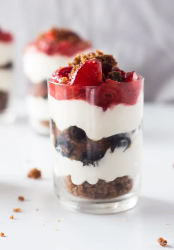 Beautiful summer berries make these festive no bake cheesecake shooters perfect for your Memorial Day or 4th of July bbq!