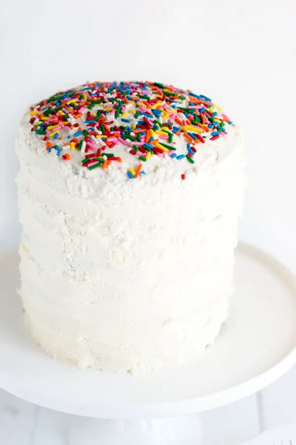 Funfetti cake is a childhood boxed favorite that now you can make from scratch! This cute six inch funfetti cake is sure to be a show stopper!