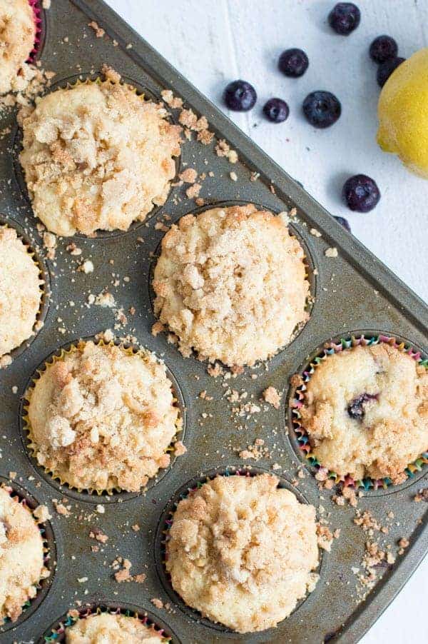 Tart lemon and sweet blueberries come together in these lemon blueberry coffee cake muffins for a sweet muffin perfect for breakfast or brunch!