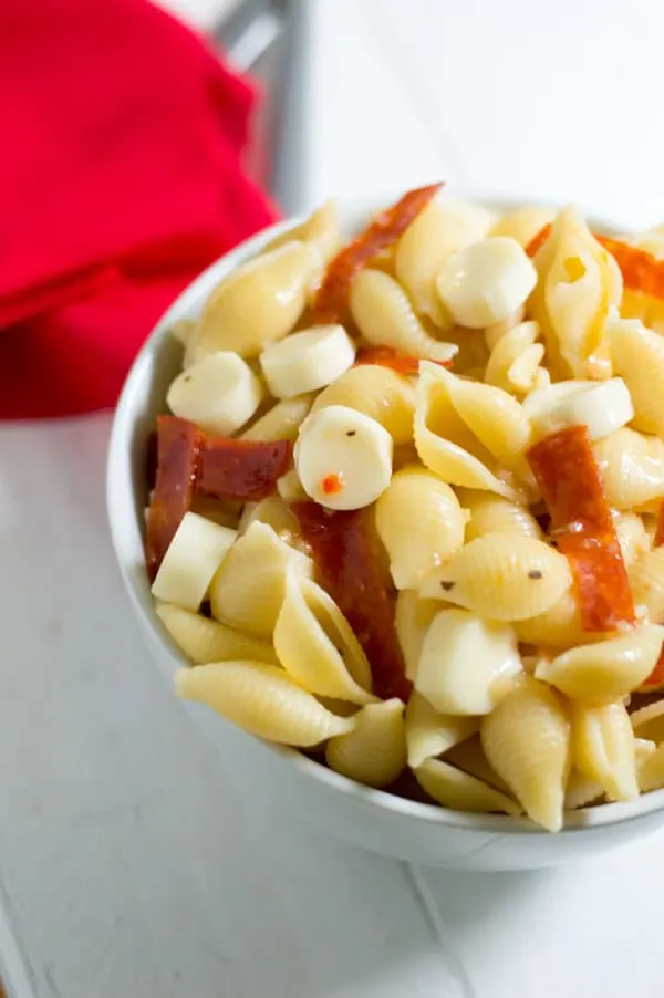 This 3 ingredient pasta salad is perfect for your next picnic or pot luck with fresh Italian dressing, creamy mozzarella, and spicy pepperoni.