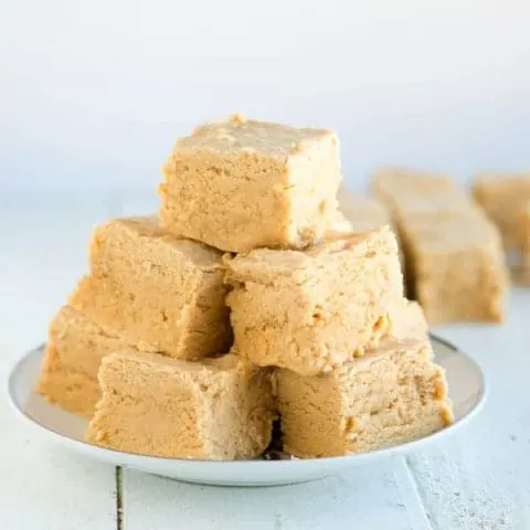 Soft peanut butter fudge is one of my favorite Christmas treats and this recipe comes together super fast with just 4 ingredients!