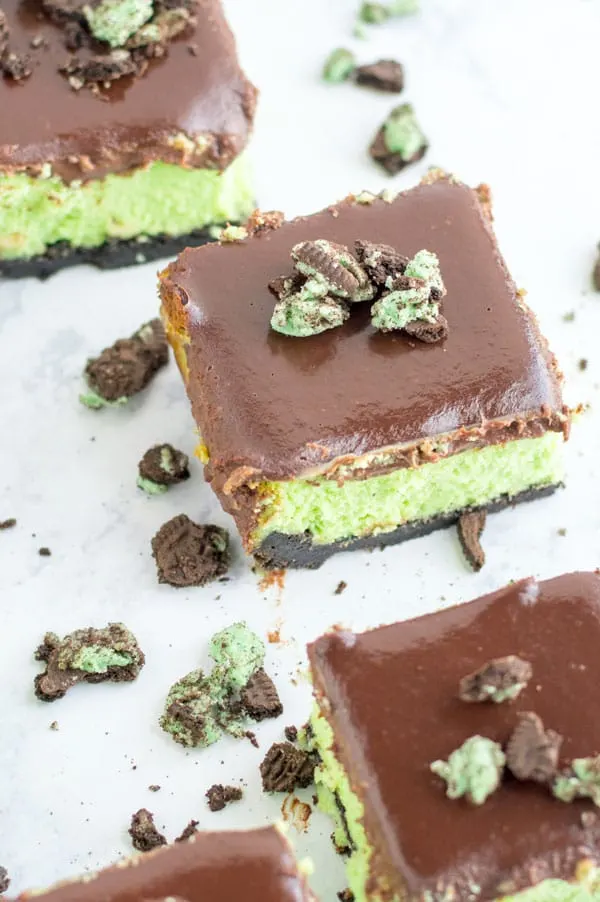 These mint oreo cheesecake bars take me back to my Girl Scout days. Except without the bowl cut and glasses as big as my face.