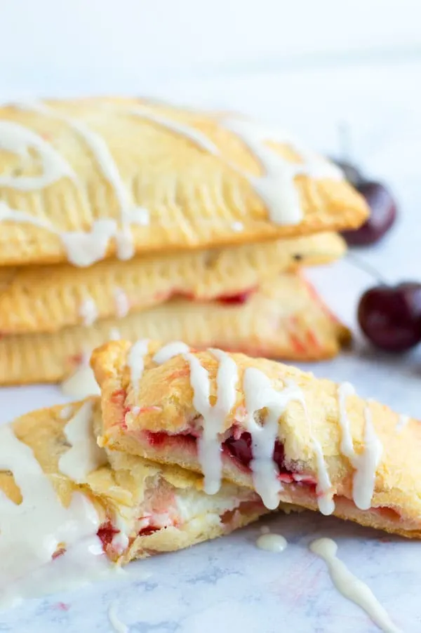 Creamy cheese cherry toaster strudels take me back to my childhood! Serve these babies up for breakfast or dessert!