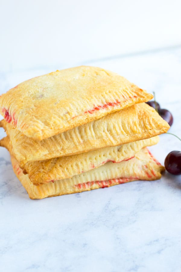 Creamy cheese cherry toaster strudels take me back to my childhood! Serve these babies up for breakfast or dessert!