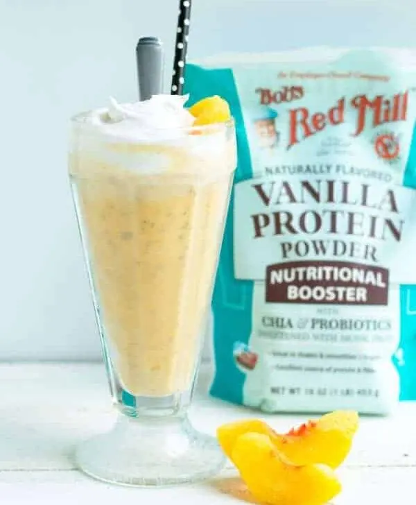This healthy peach protein milkshake is a deceptively easy snack that's great for a midday treat!