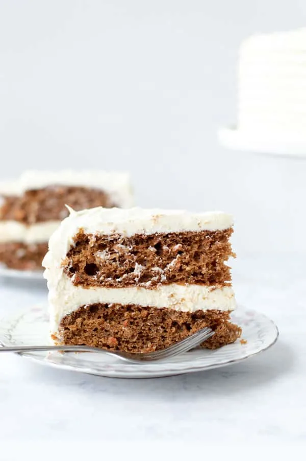 This is Best Homemade Carrot Cake Recipe You’ll Ever Make. No, really. This really is the best homemade carrot cake recipe you’ll ever make. Moist, perfectly spiced, and without getting carrot shreds stuck in your teeth! Your families will love this easy dessert. Plus it is topped with decadent cream cheese frosting. #carrotcake #homemade #recipe #dessert #cake